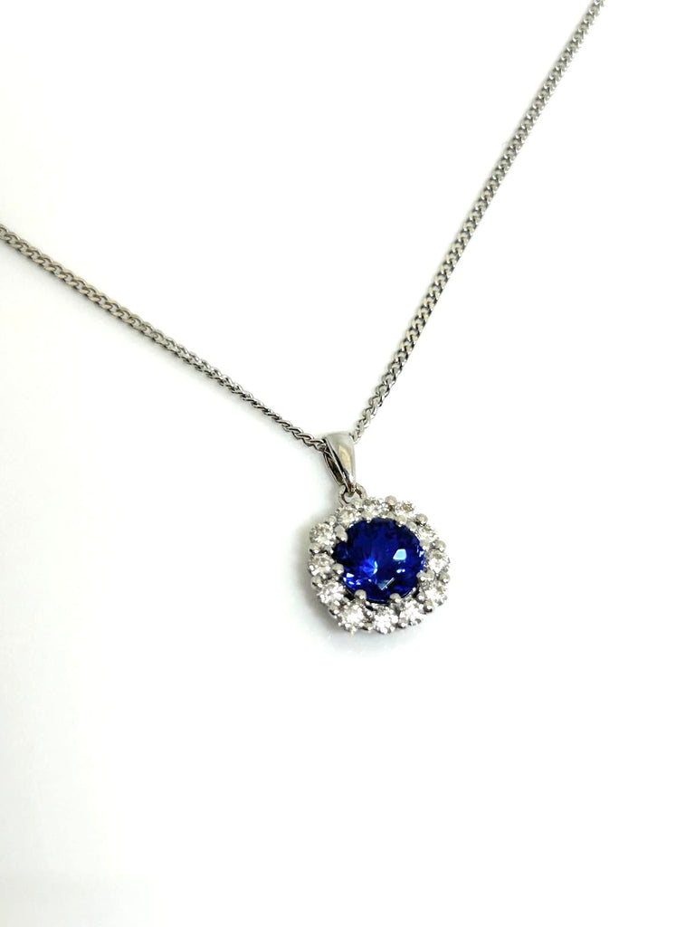 18CT TANZANITE AND DIAMOND HALO PENDANT