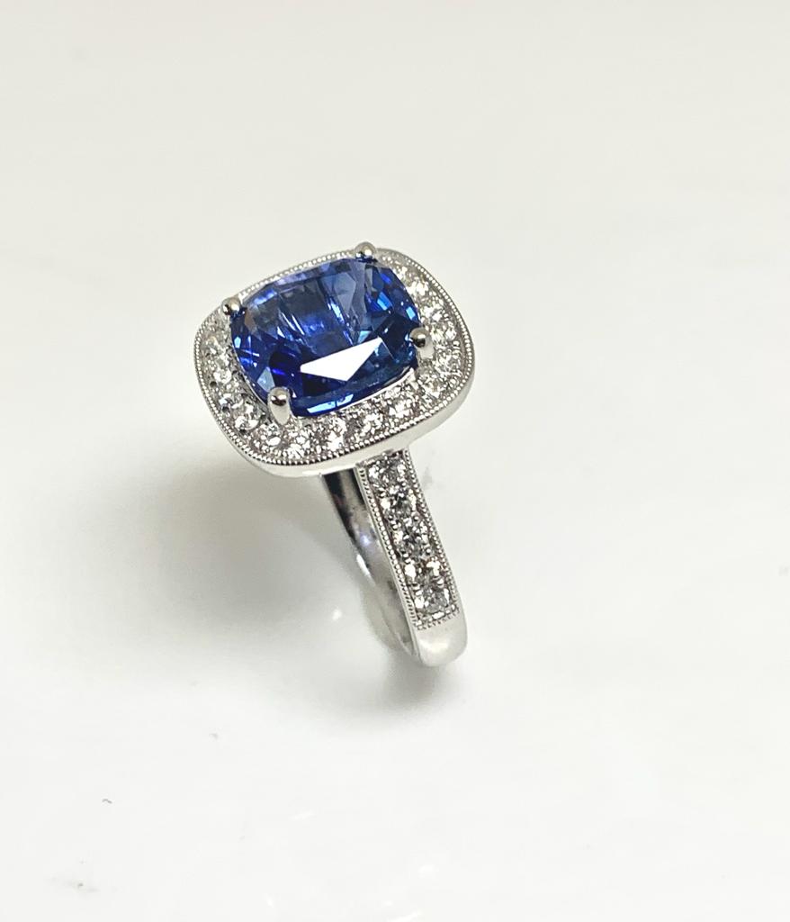 4.69CT SRI LANKAN SAPPHIRE AND HALO DIAMOND PLATINUM RING