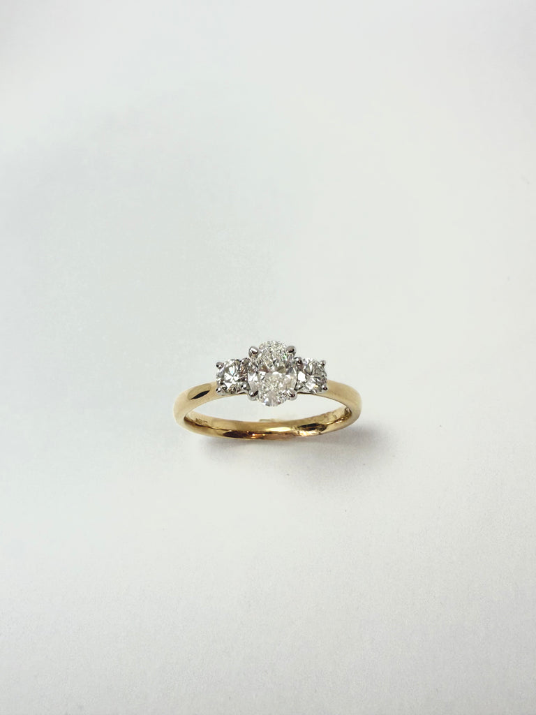 18CT 78PT OVAL DIAMOND CENTRE TRILOGY RING