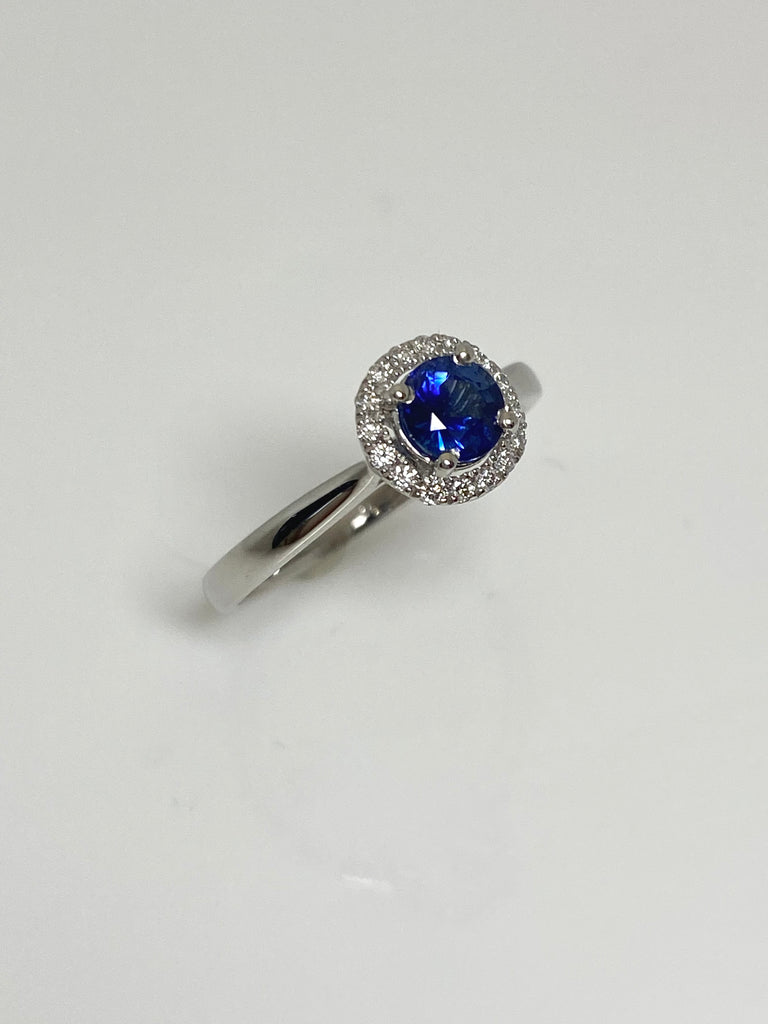 PLATINUM 50PT SAPPHIRE AND 15PTS DIAMOND HALO RING