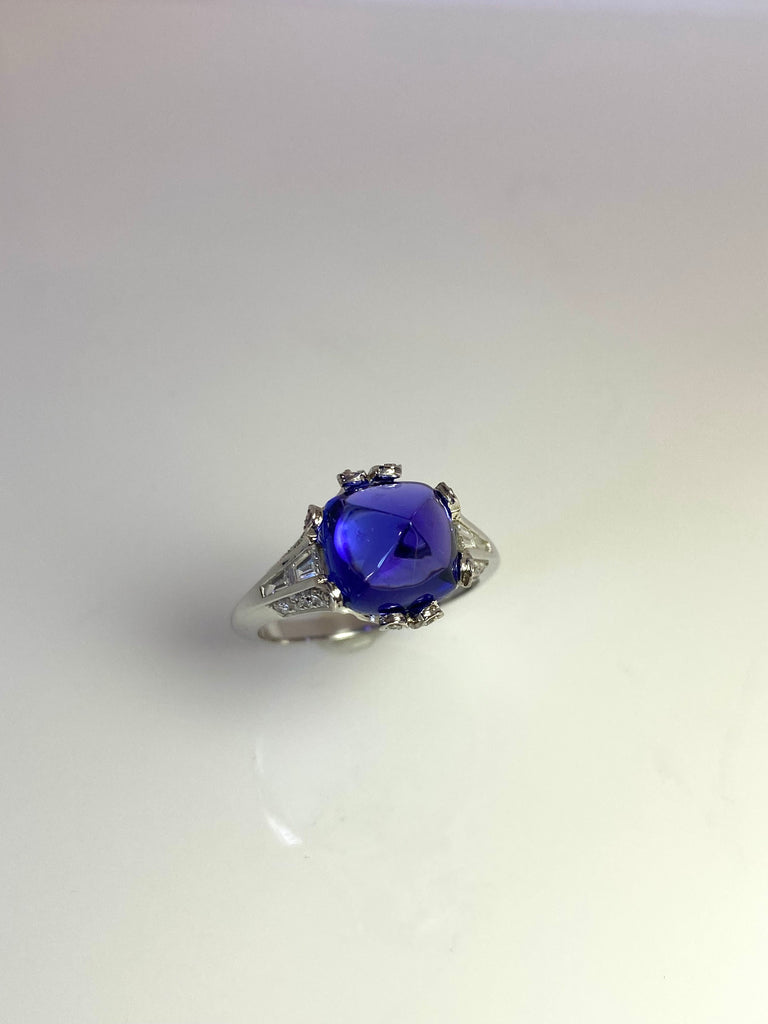 18CT WHITE GOLD TANZANITE CABOCHON AND DIAMOND RING