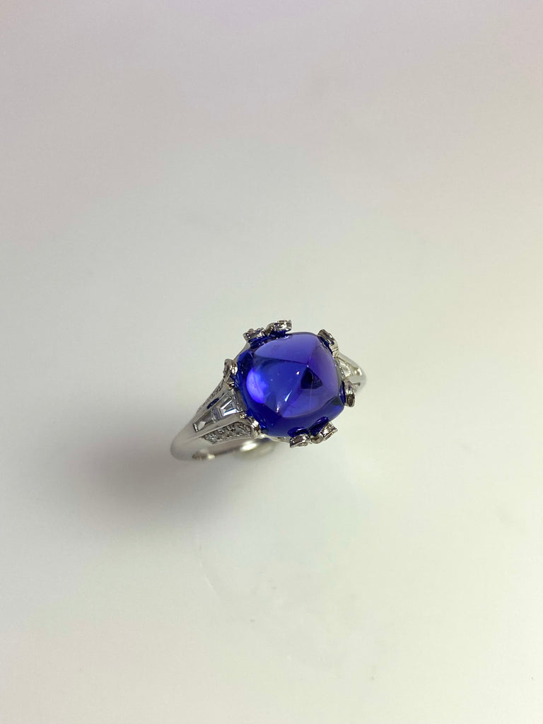 18CT WHITE GOLD TANZANITE CABOCHON AND DIAMOND RING