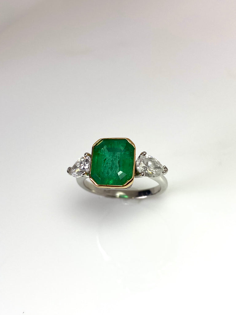 PLATINUM 3.28CT EMERALD WITH PEAR SHAPED DIAMONDS TRILOGY RING