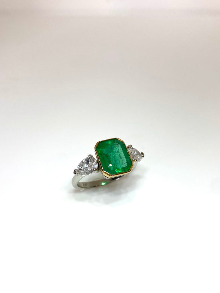 PLATINUM 3.28CT EMERALD WITH PEAR SHAPED DIAMONDS TRILOGY RING