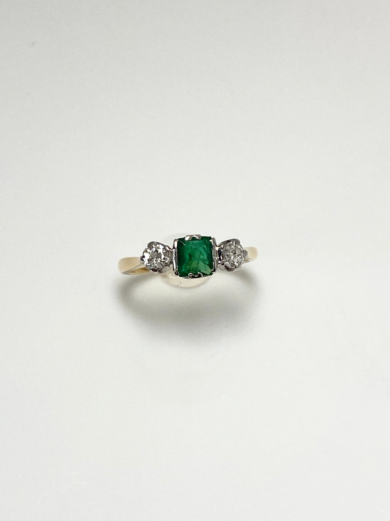 18CT 35PTS EMERALD AND 20PT DIAMOND TRILOGY RING
