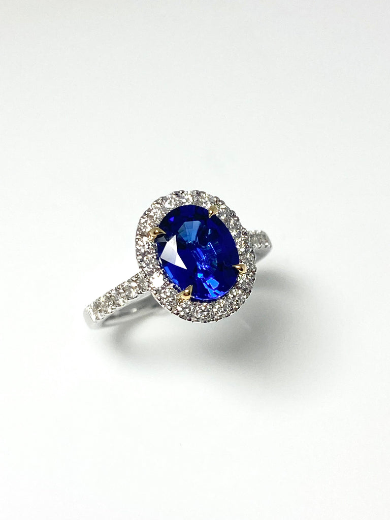 18CT WHITE GOLD 1.90CT TANZANITE AND DIAMOND HALO RING