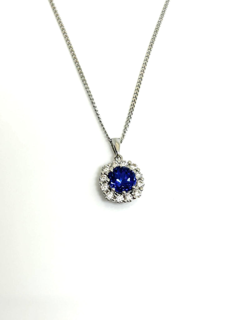 18CT TANZANITE AND DIAMOND HALO PENDANT