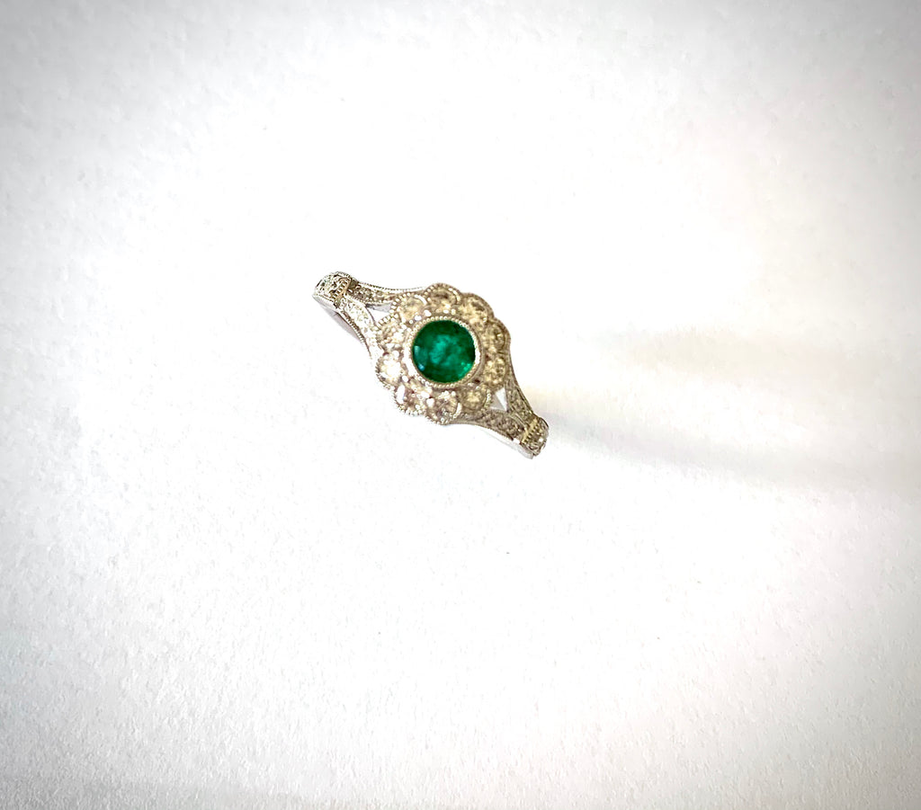 18CT WHITE GOLD EMERALD AND DIAMOND RING