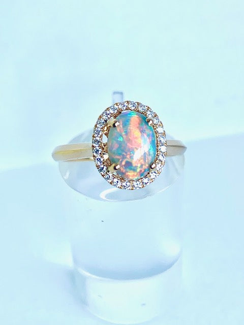 18CT YELLOW GOLD HALO OPAL AND DIAMOND RING