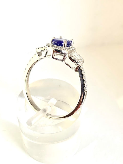 18CT TANZANITE AND DIAMOND HALO DESIGN RING